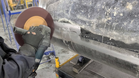 Adhesive and silicone removed with more aggressive, dry abrasive action (120 grit).
